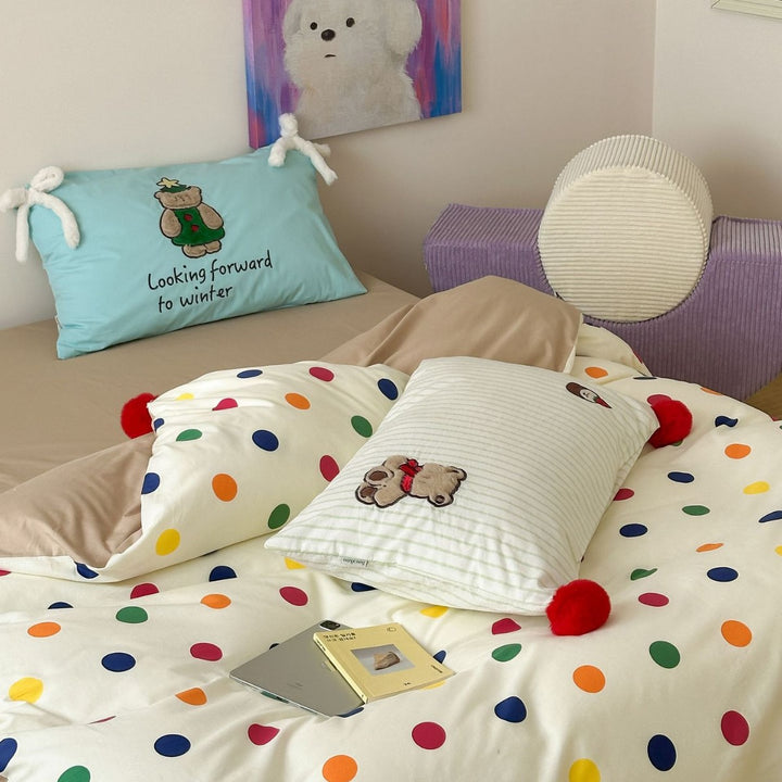 Playful cotton bedding set with pompom trim and embroidered rabbit motif