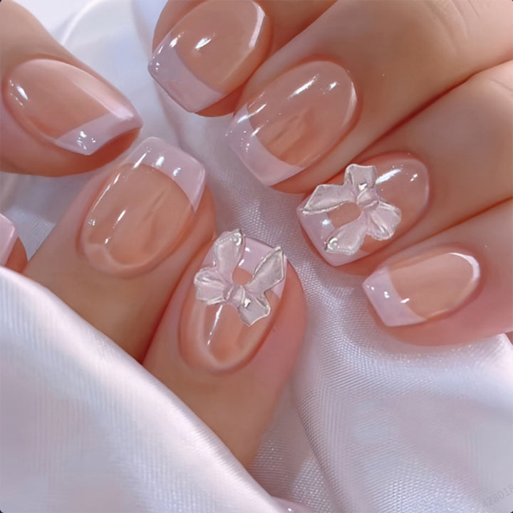 Artificial Nail Set with Romantic Bows and French Tip Bowlift