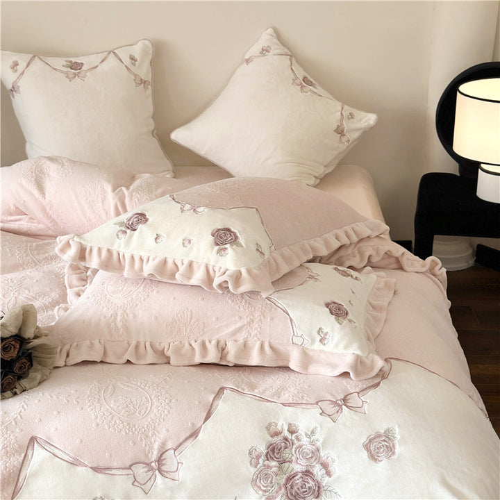 Romantic embroidered bedding set with ruffles and rose motifs