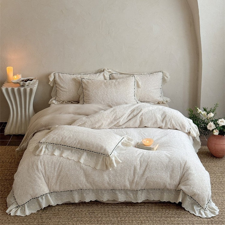 Romantic bedding set with ruffles, lace and subtle flower pattern Bowlift
