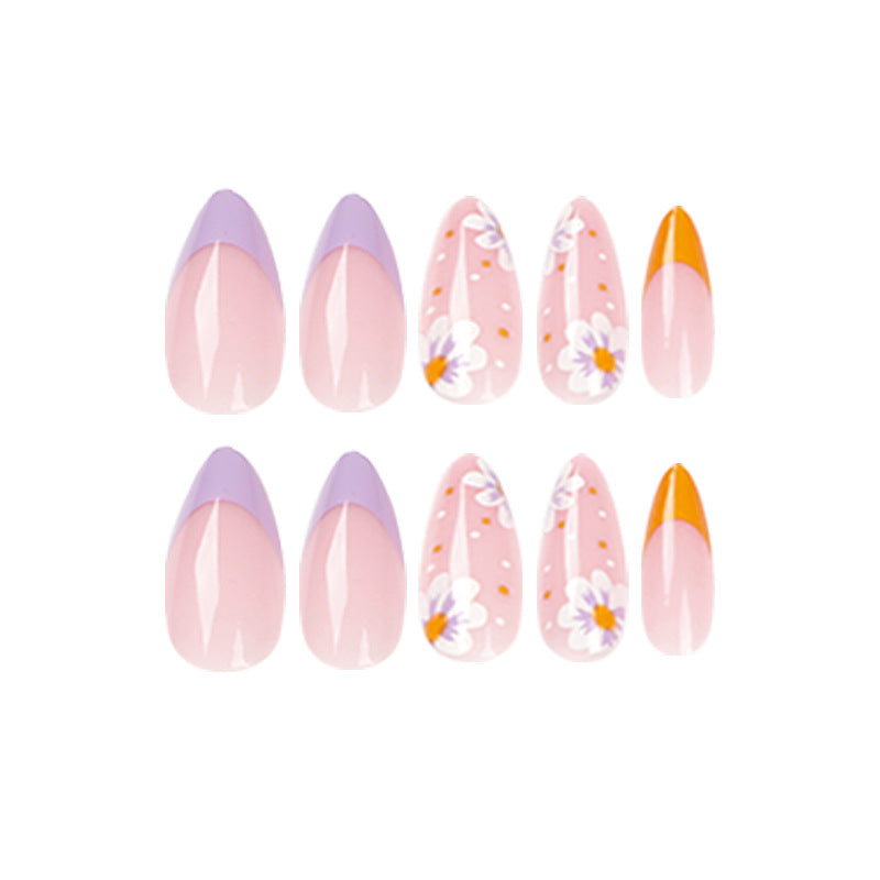 Artful nail art with floral accents and gradient colors Bowlift