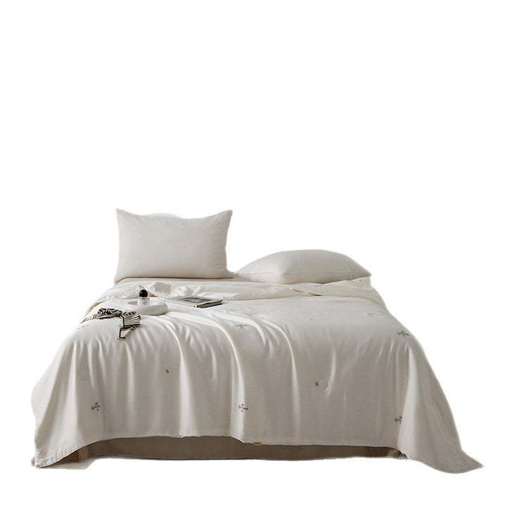 Silk bed cover made of microfiber with subtle embroidery and ultra-light fall