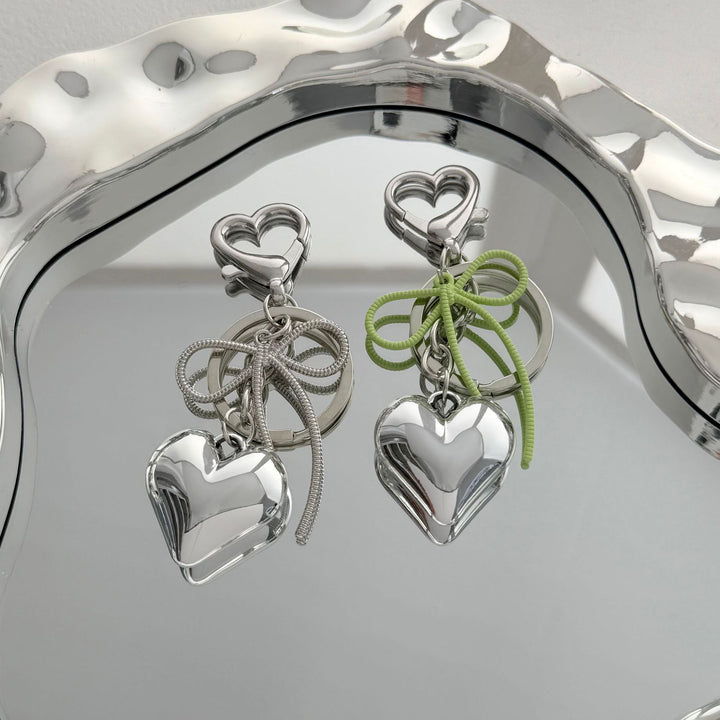 Heart-Shaped Metallic Keychain with Decorative Bow Bowlift