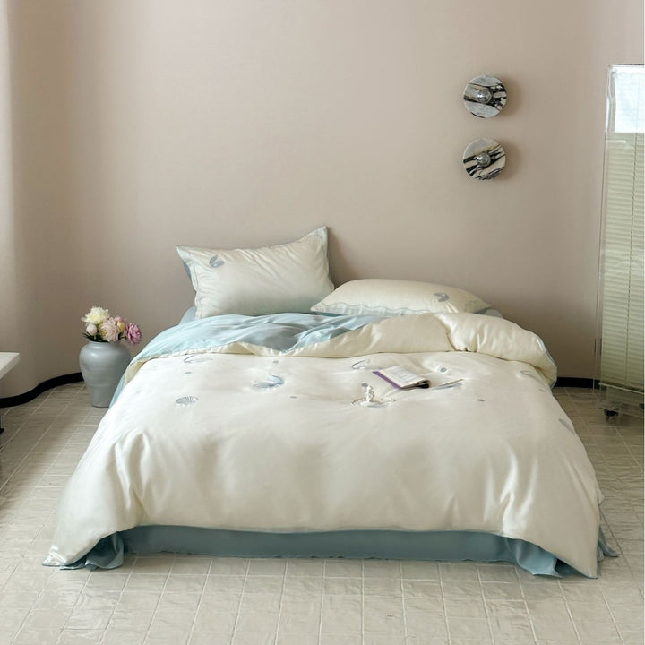 Luxurious satin bedding set with shell embroidery and reversible finish