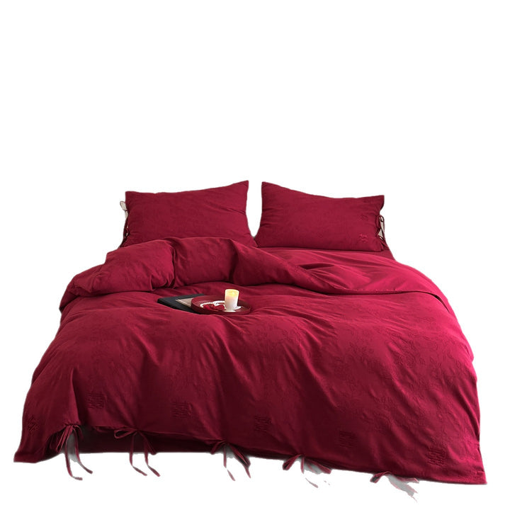 Luxurious cotton satin bedding set with decorative ribbons and jacquard texture