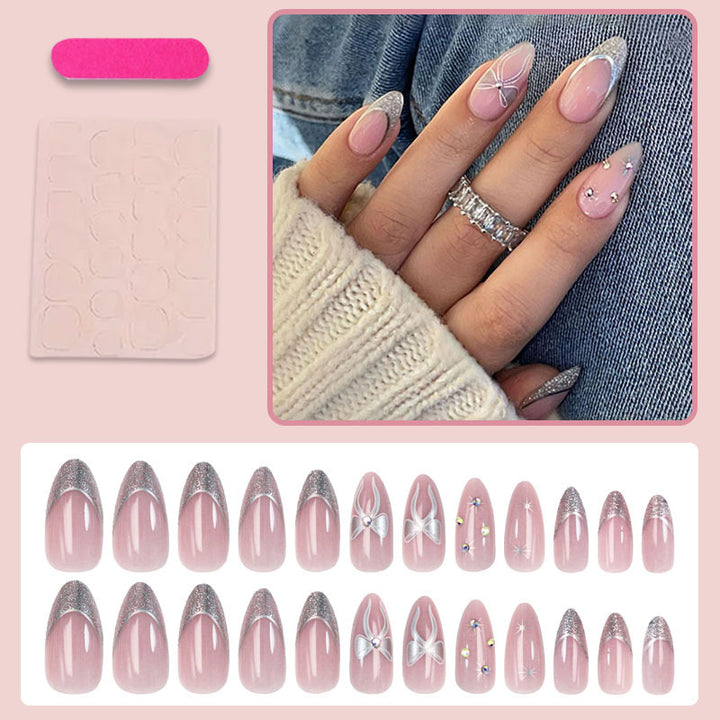 Artificial nail set with glamorous glitter and flower accents Bowlift