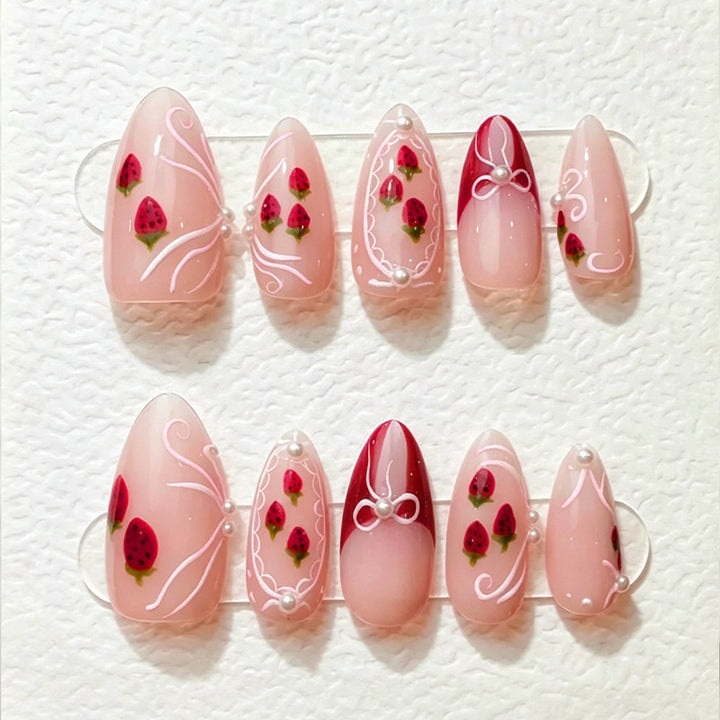 Artificial nail set with romantic strawberry and bow motifs Bowlift