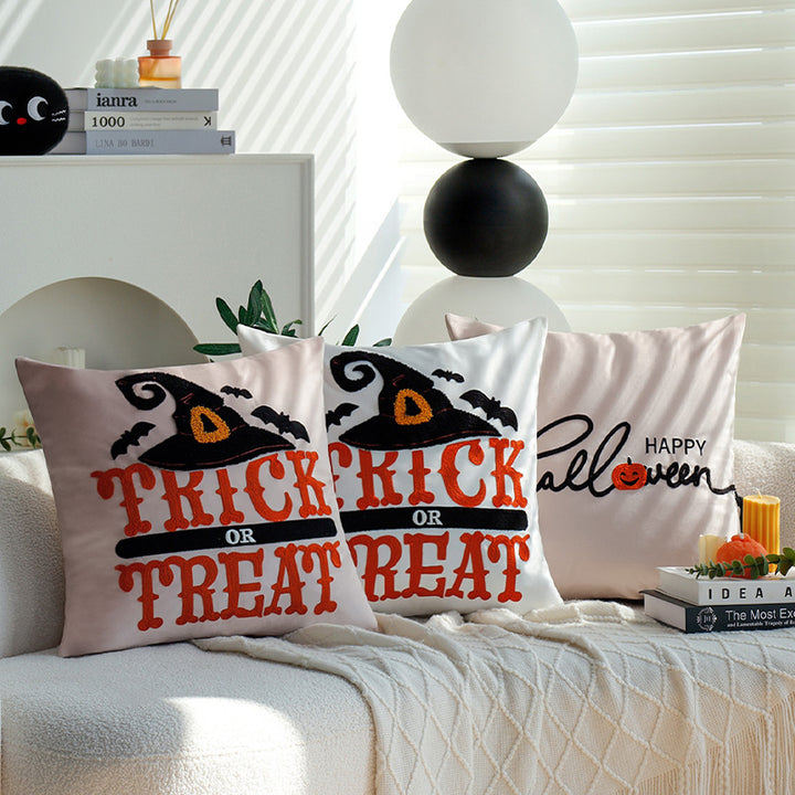 Square decorative cushion cover with witch hat appliqué and 'Trick or Treat' tufting Bowlift