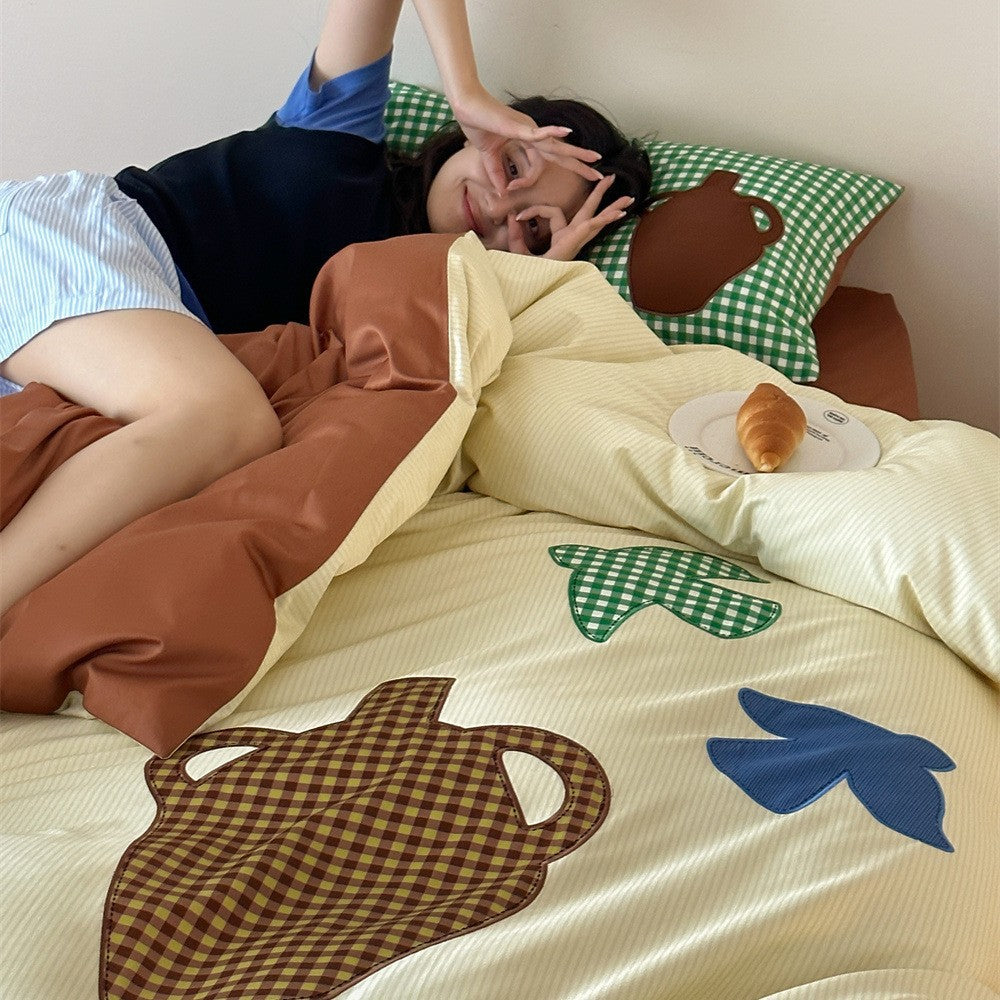 Duvet cover set with applied ceramic and check details, reversible function