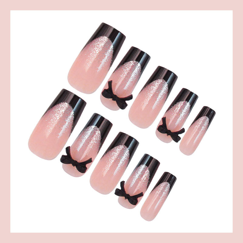 Artificial nail set with elegant glitter accents and bow details Bowlift