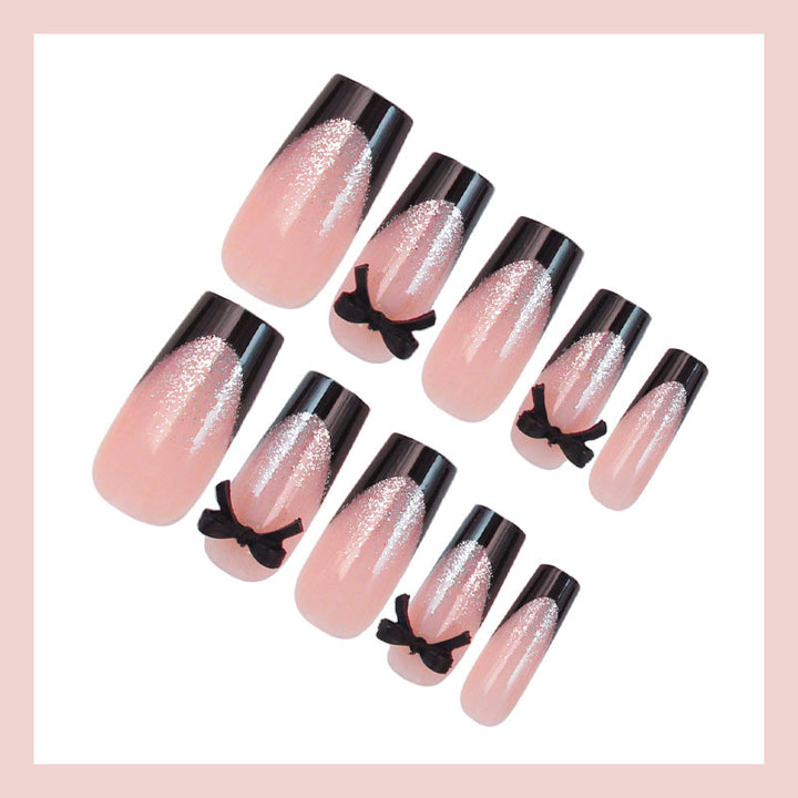 Artificial nail set with elegant glitter accents and bow details Bowlift