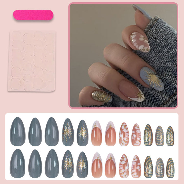 Nail art set with elegant gold accents and creative design Bowlift