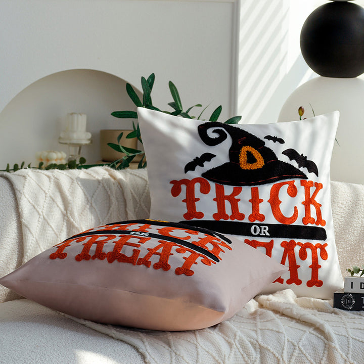 Square decorative cushion cover with witch hat appliqué and 'Trick or Treat' tufting Bowlift