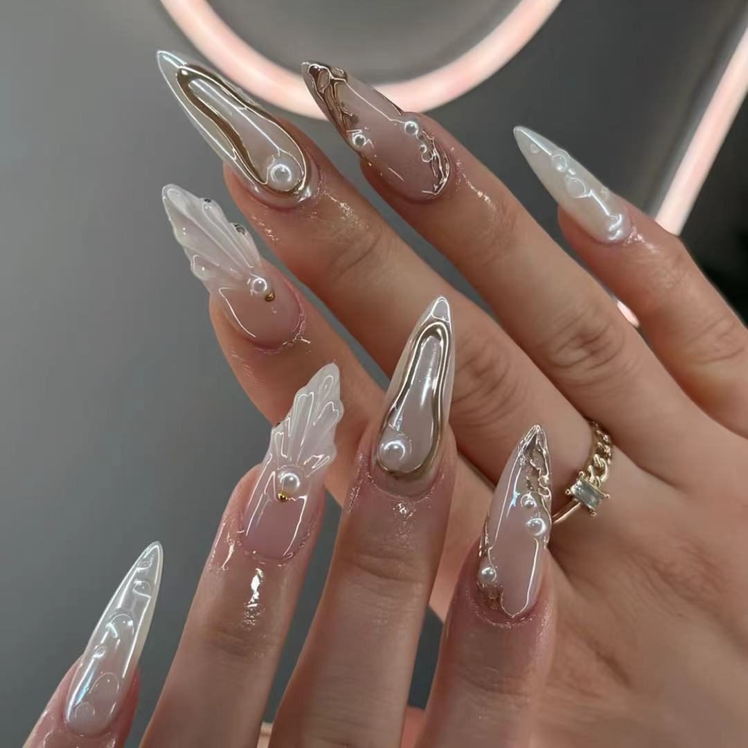 Artistic Press-On Nail Designs with Pearl Accents Bowlift