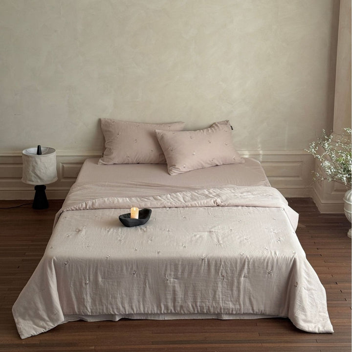 Linen bedding set with subtle floral embroidery