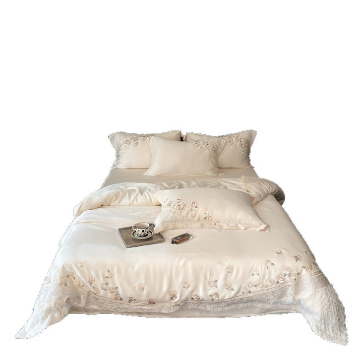 Luxurious satin bedding set with rose embroidery and fringed trim