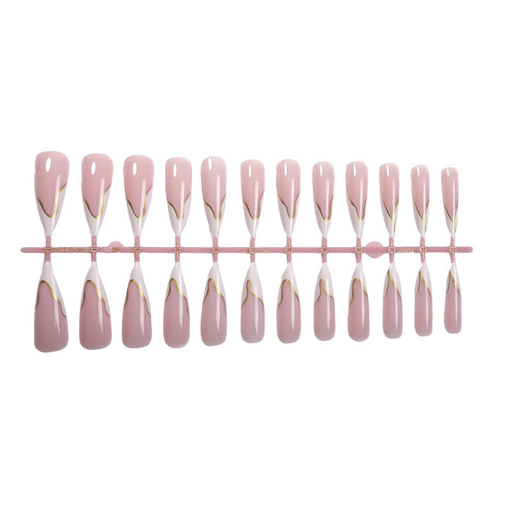 Artifical nail set with elegant gold trim and delicate pink Bowlift