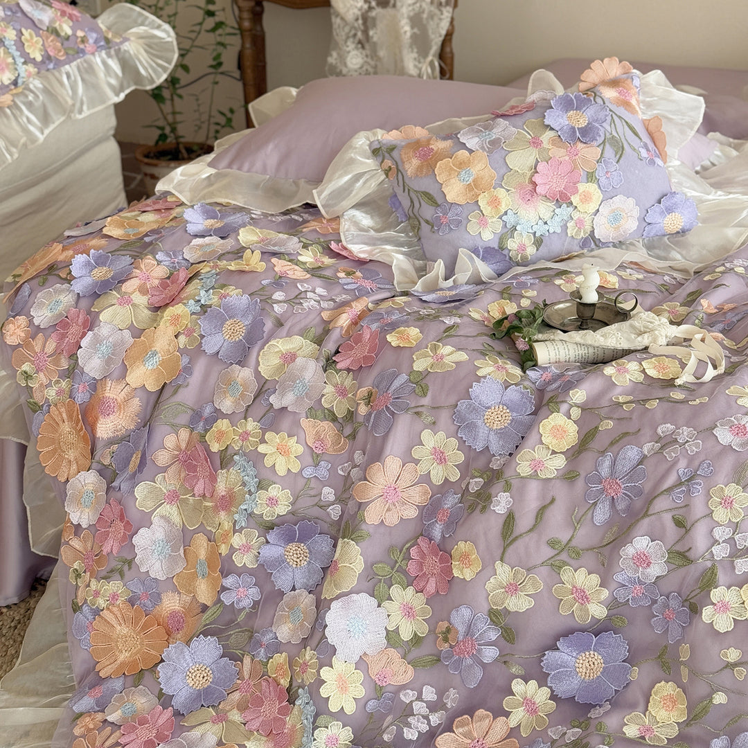 Embroidered bedding set with 3D flower application and ruffle hem
