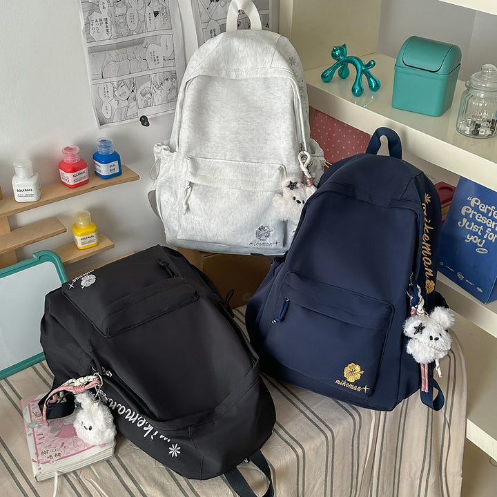 Versatile Lightweight Backpack with Decorative Accents Bowlift