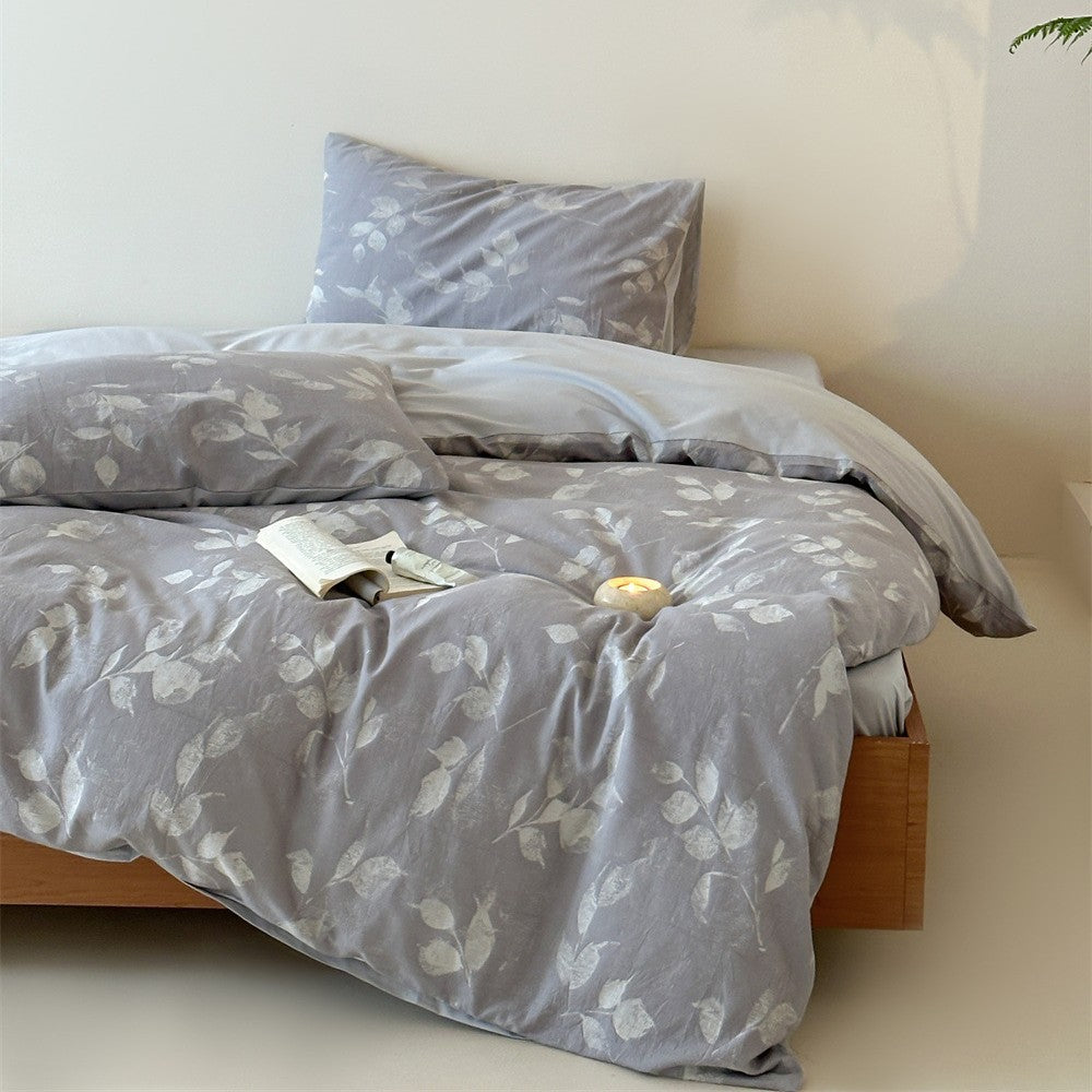 Bedding set made of washed cotton satin with a textured houndstooth pattern and reversible function
