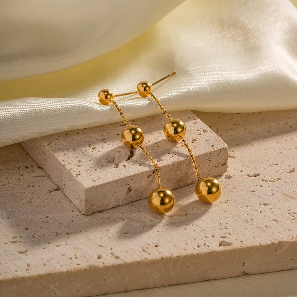 BowLift | Dangle Gold Bead Tassel Earrings