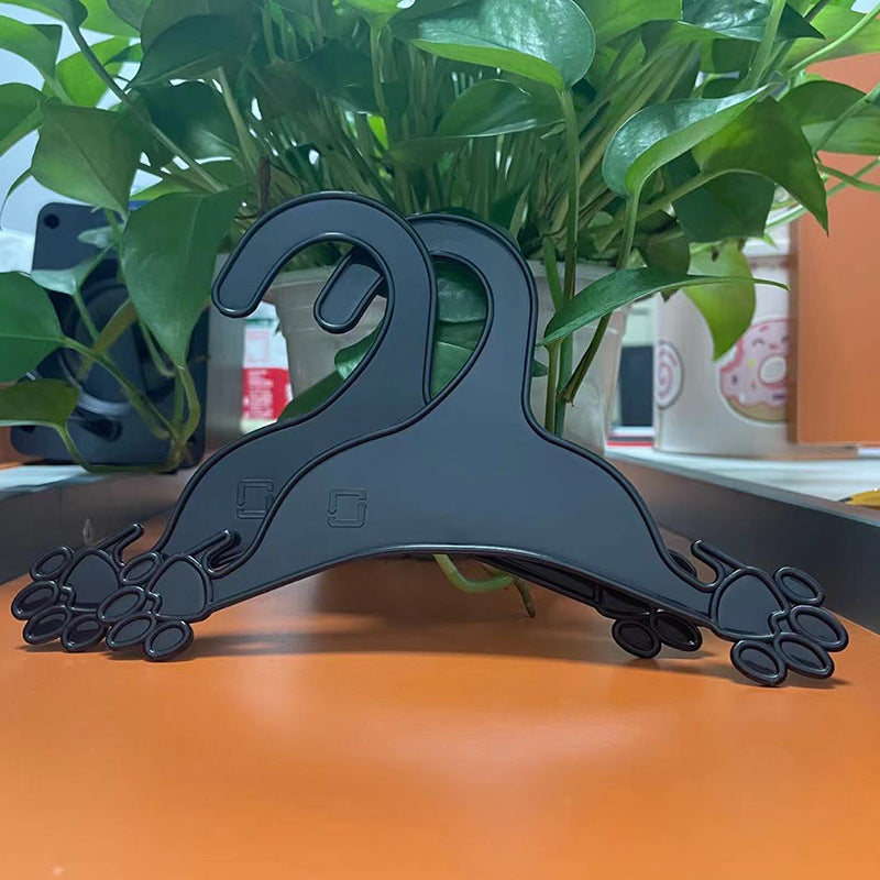 Plastic clothing hanger in dog paw shape