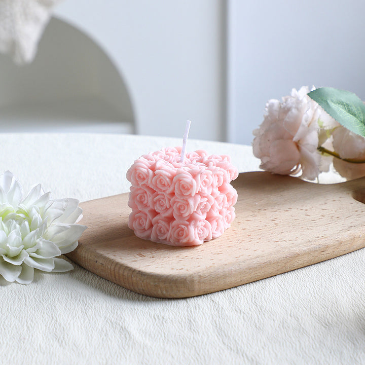 Rose-colored scented candle made from soy wax, handcrafted
