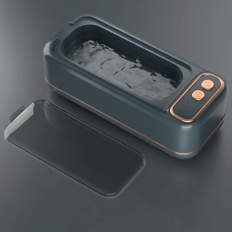 Ultrasonic cleaning device, portable, double chamber