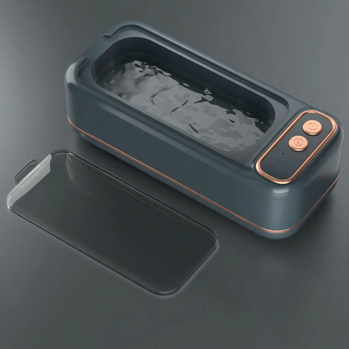 Ultrasonic cleaning device, portable, double chamber