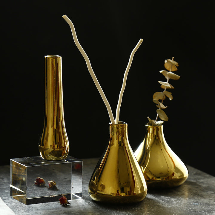 Ceramic flower vase with gold finish, geometric
