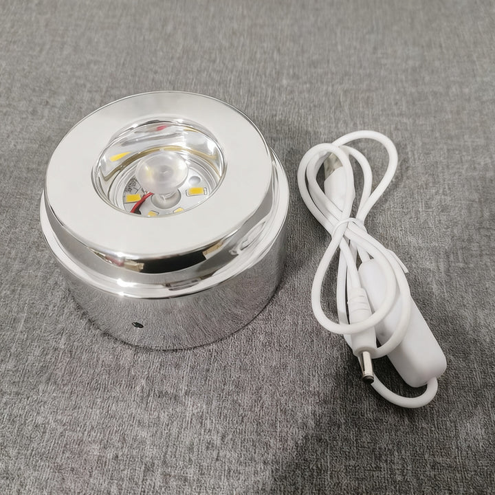 Glowing crystal ball with rotating base