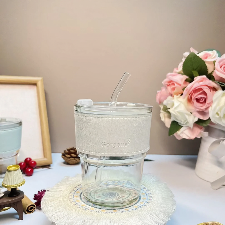 Glass drinking cup with straw