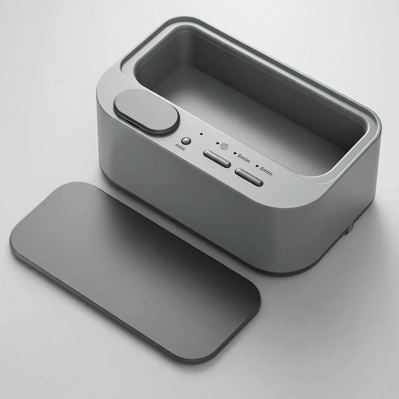 Ultrasonic cleaning device, portable, double chamber