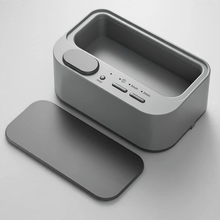 Ultrasonic cleaning device, portable, double chamber