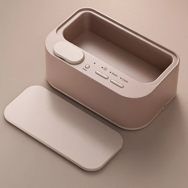 Ultrasonic cleaning device, portable, double chamber
