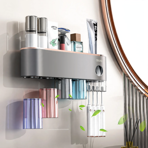 Toothbrush wall holder with toothpaste squeezer