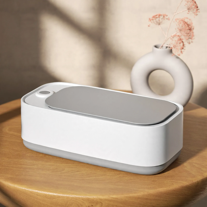 Double chamber ultrasonic cleaning device