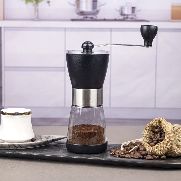 Hand-crank coffee grinder made of glass